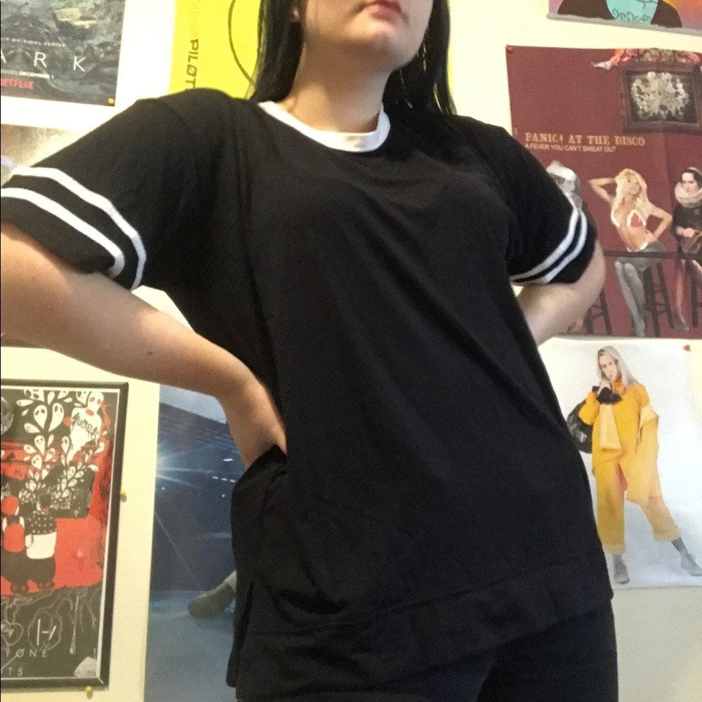 Black shirt with stripe detail on sleeve